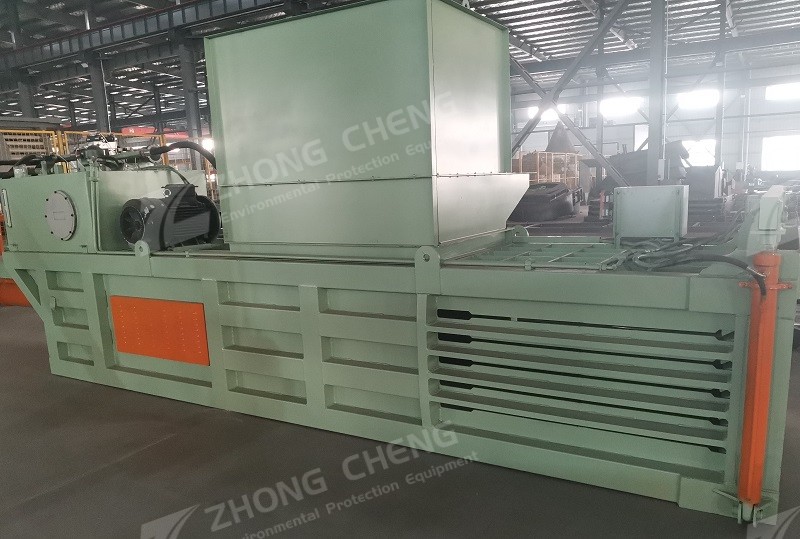 Horizontal garbage baler
